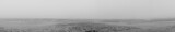 Fototapeta Na ścianę - panoramic image of low tide in a river with silt on a very foggy day