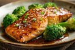 Asian-Inspired Elegance: Sesame Ginger Glazed Salmon with Steamed Broccoli - Wild-Caught Salmon Fillets Glazed in a Sesame and Ginger Marinade, Served with Fresh Steamed Broccoli for a Balanced Meal.
