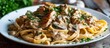 Creamy Chicken Marsala Pasta with Parsley, homemade on a plate.