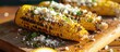 Grilled corn with creamy topping and cotija cheese.