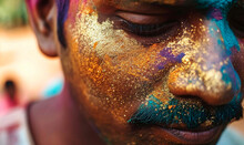 Macro Shot Of Texture And Shimmer Of Golden And Teal Holi Powders On An Indian Man Face
