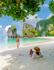 Wall Mural - Koh Hong Island Krabi Thailand, a couple of men and women on the beach of Koh Hong, a tropical white beach with Asian women and European men in Krabi Thailand