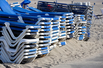 Wall Mural - Stacked beach chairs wait for bathers at Hoek Van Holland beach