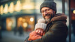Heartwarming moment of a smiling father holding his joyful child in a winter city setting.