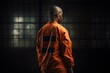 Unrecognizable black prisoner in orange uniform in prison, African American convicted of crime rear view. Illustration created by Generative AI