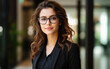 © PRASANNAPIX - young and beautiful businesswoman wearing sun glasses