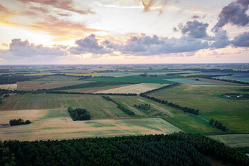 Wall Mural - aerial panorama panorama view of landscape with fields t sunset