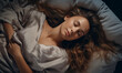 © JQM - Overhead shot of a woman sleeping comfortably, bed advertisement material, promoting restful sleep