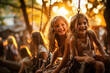 Two joyful young girls swinging on a playground at sunset, radiating happiness and sharing a carefree childhood moment.