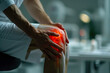 Hands of an adult patient holding his knee, close-up, pain highlighted in red, doctor's office preparing to examine a knee injury as a result of a sports injury