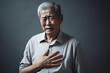© Kitta - Asian senior man suffering from chest pain at home. Healthcare and medical concept