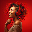 Woman with dreadlocks listening to music on red background.