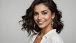 Closeup portrait of a beautiful young middle eastern model woman smiling with white teeth