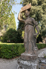 Wall Mural - Caprarola, Viterbo, Italy - 2023, September 12: Woman statue in the Palazzo Farnese Italian Renaissance garden.