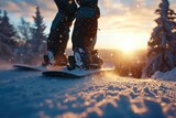 A person standing on a snowboard in the snow. Perfect for winter sports and outdoor adventure themes