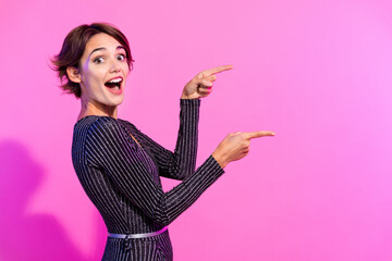 Sticker - Photo of impressed cheerful lady wear glamour outfit pointing two fingers empty space isolated vivid pink color background