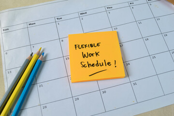 Wall Mural - Concept of Flexible work schedule write on sticky notes isolated on Wooden Table.