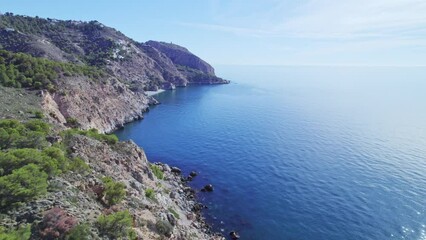 Wall Mural - Cliffs on the Mediterranean coast. Aerial view of medieval watchtowers next to the cliffs. Mediterranean coast landascape. Andalusia. Spain.