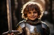 Portrait of a cute little boy in medieval armor with a sword