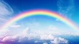Fototapeta Tęcza - A vibrant rainbow stretching across a clear blue sky