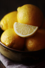 Wall Mural - A bowl with yellow bright lemons	