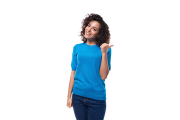 Wall Mural - young woman with curly natural hair style dressed in a blue sweater