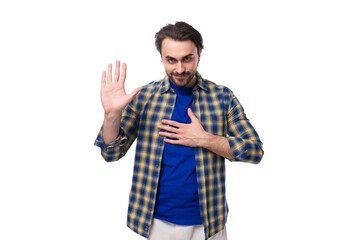 Wall Mural - young caucasian brutal man with unshaven face dressed in a plaid stylish shirt