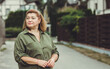 © T.Den_Team - Mature plus size lady outdoor portrait at street. Middle aged People psychology concept