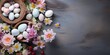 grey easter background, flat lay style, easter eggs and blossom