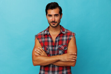 Wall Mural - Guy man confident friendly travel crossed arm trendy shirt blue attractive smile happy background plaid