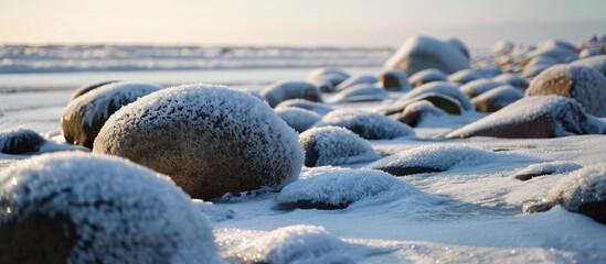 Sticker - Winter on the Baltic coast with snow-covered stones.