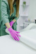 © Alex May - An hair removal master spreads a protective film on the couch for a girl patient before starting a procedure in a beauty salon, a cosmetologist in a cosmetology office loves sterility and cleanliness