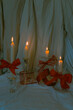 Christmas candle trend with red ribbons and cinematic dark style