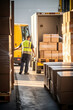 © Andrii Zastrozhnov - Workers in a bustling warehouse load and unload trucks with cardboard boxes using forklifts.