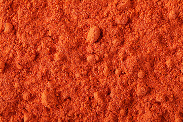 Sticker - Red paprika powder background and texture