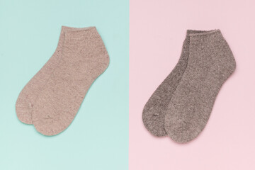 Wall Mural - Two pairs of warm socks on a two-tone background.