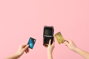 Poster - Women with credit cards and payment terminal on pink background