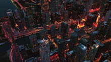 Illuminated City Night Cityscape Aerial Shot In A City Crowded Streets And Heavy Traffic 4K Drone Footage
