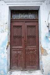 Old historical colorful doors and shutters made of wrought iron and wood. Old historical wooden doors in Cyprus. Doors and shutters of historical stone houses in Nicosia.