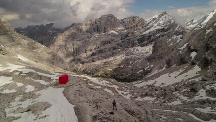 Wall Mural - Aerial of red bivacco slataper surrounded by Sorapis mountains, Dolomites, northern Italy