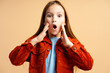 Portrait of excited shocked little girl wearing casual clothes with open mouth looking at camera