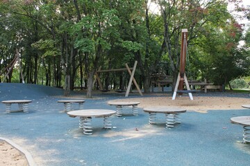 Wall Mural - Wooden modern ecological safety children outdoor playground equipment in public park. Nature architecture construction playhouse in city. Children rest and childhood concept. Idea for games on air.