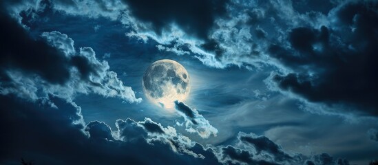 Canvas Print - Moon shining through clouds at night