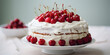 Delicious cake with vanilla buttercream frosting and fresh cherries on top, white table and blurry background 