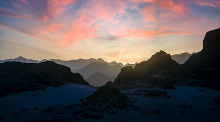 Wall Mural - peaks of mountains in the desert against sunset