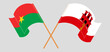 Crossed and waving flags of Burkina Faso and Gibraltar