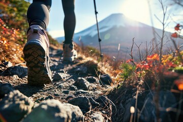 mountain adventure: person in hiking boots walking with mount fuji in the background - japan, a thri