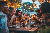 Fototapeta Natura - Happy smiling friends drinking beer glasses sitting at brewery pub restaurant table