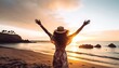 Happy woman with arms up enjoy freedom at the beach at sunset. Wellness, success, freedom and travel