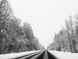 Wall Mural - Empty snowy asphalt road, winter